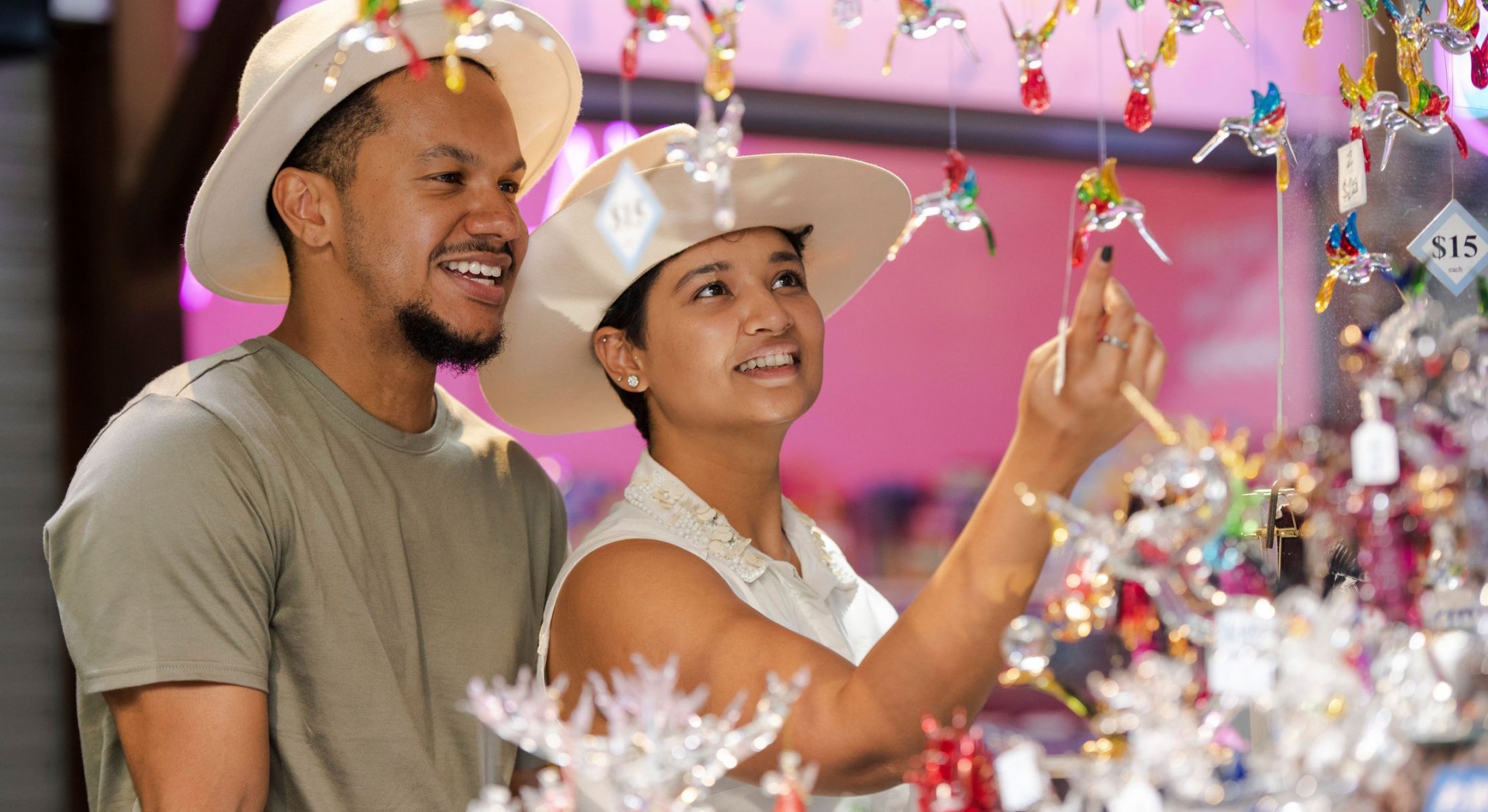 Couple browsing craft stall at Night Markets, Cairns