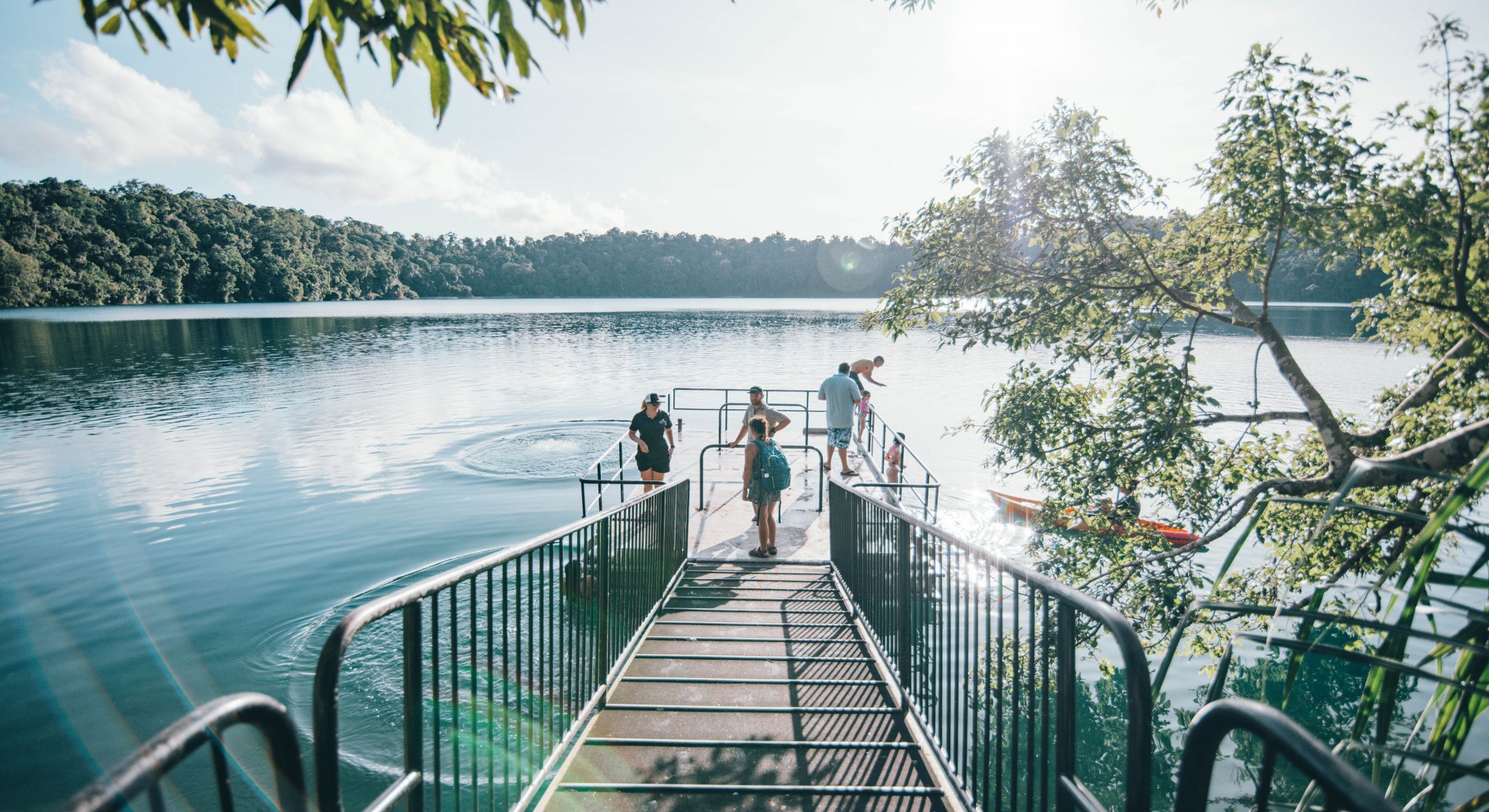 Family preparing to swim at Lake Eacham, Crater Lakes National Park