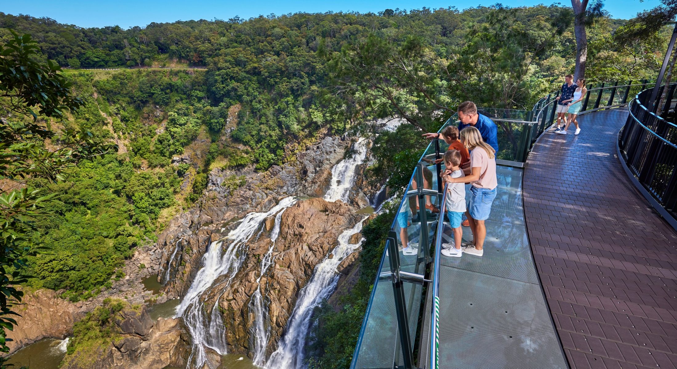 Family looking over bridge above barron gorge